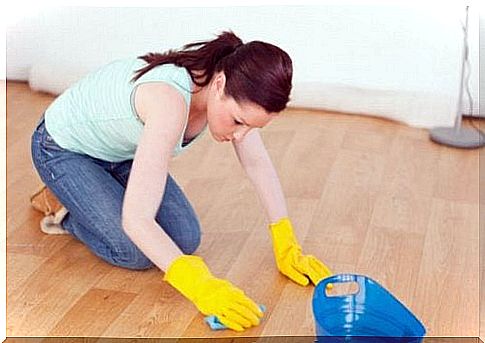 Wife cleans the floor