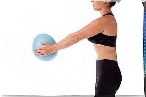 A woman with a pilates ball