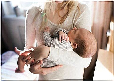 mother holding baby