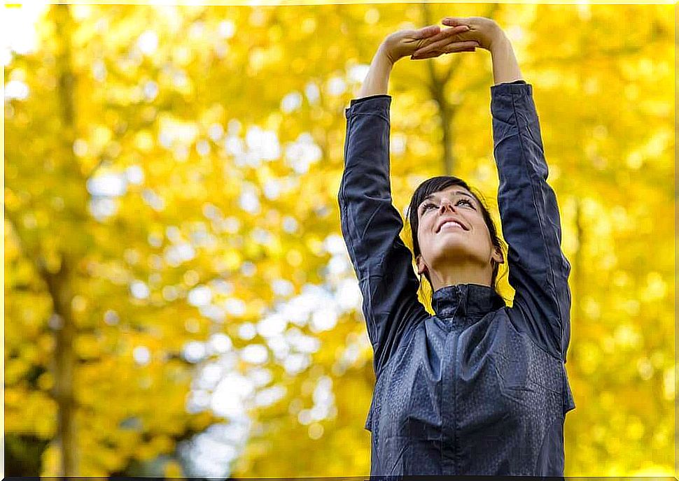 woman doing stretching exercise outside