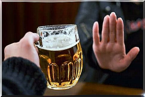 A man turns down a glass of beer