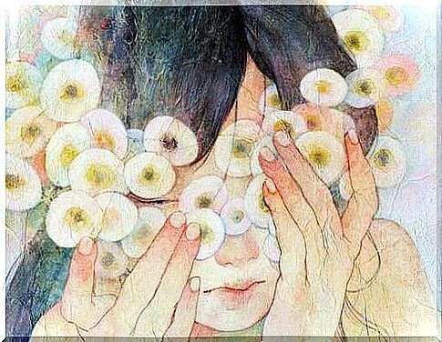 Girl hiding behind flowers