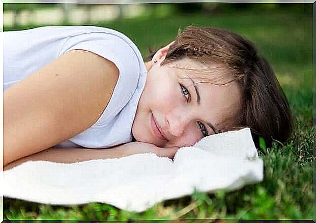 Woman is relaxing on the grass